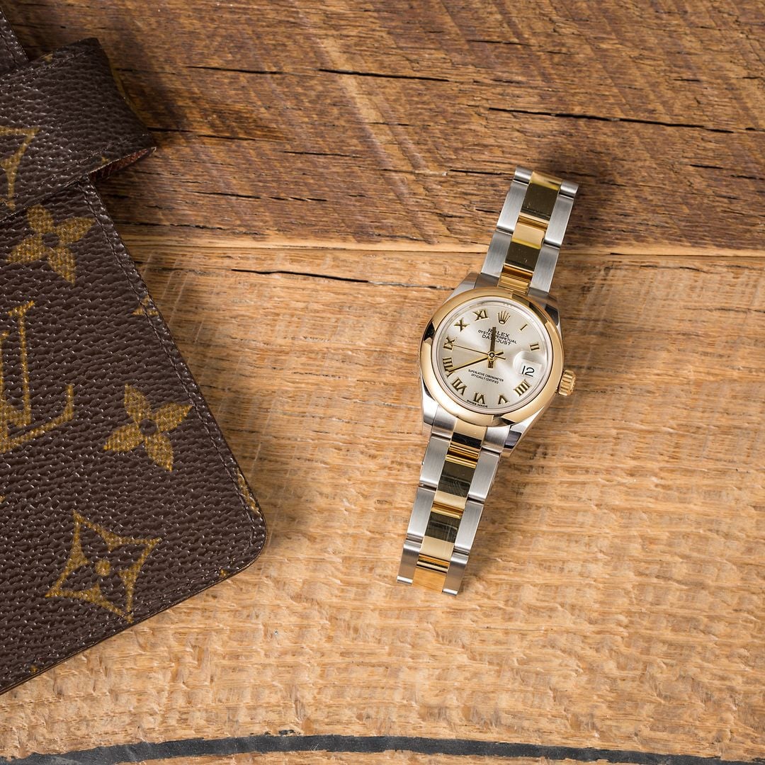 A Rolex Lady-Datejust 28 accompanied by luxury wallet